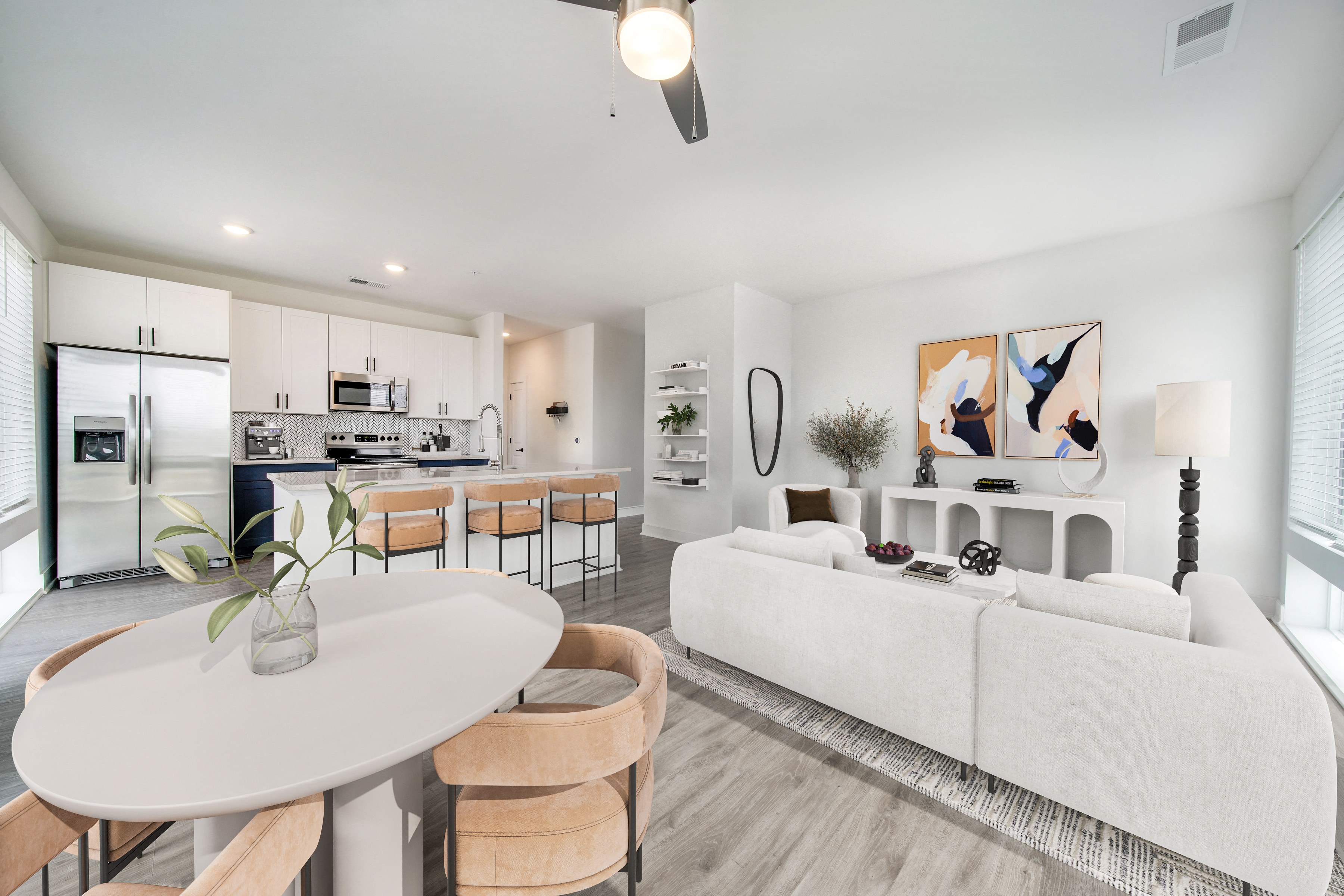 an open living room and kitchen with a white table